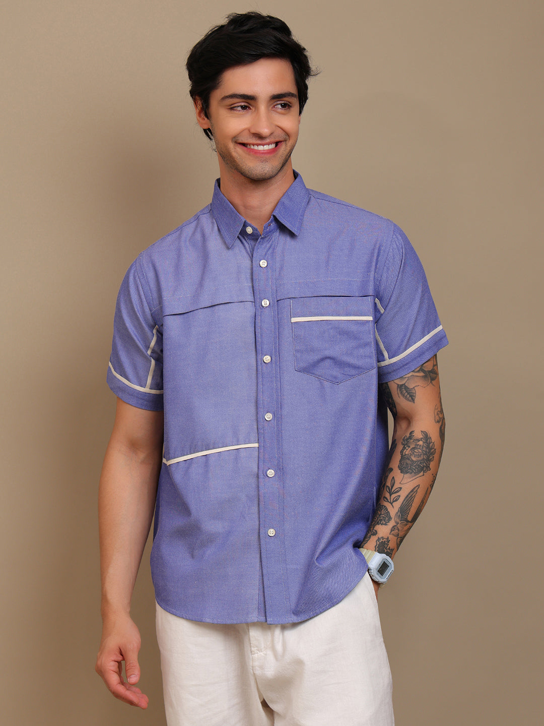 A man wearing blue shirt and smiling